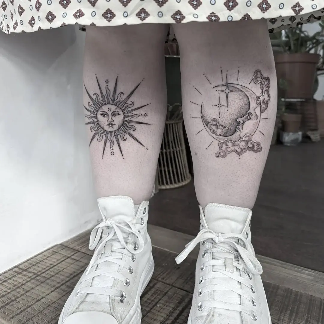 Elegant sun and moon tattoo pair on legs