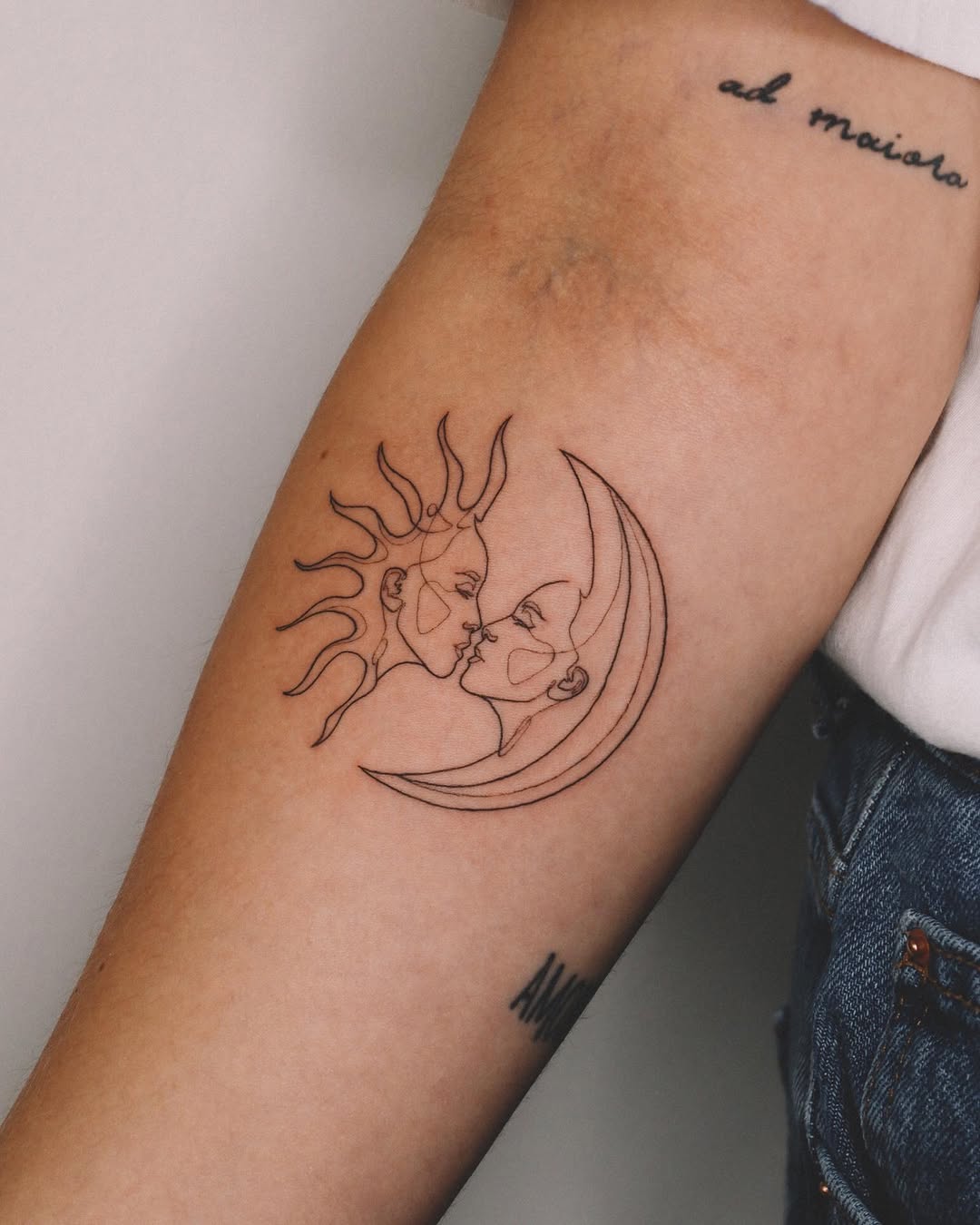 Elegant sun and moon face tattoo design