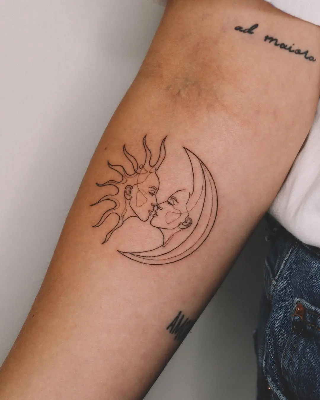 Elegant sun and moon face tattoo design