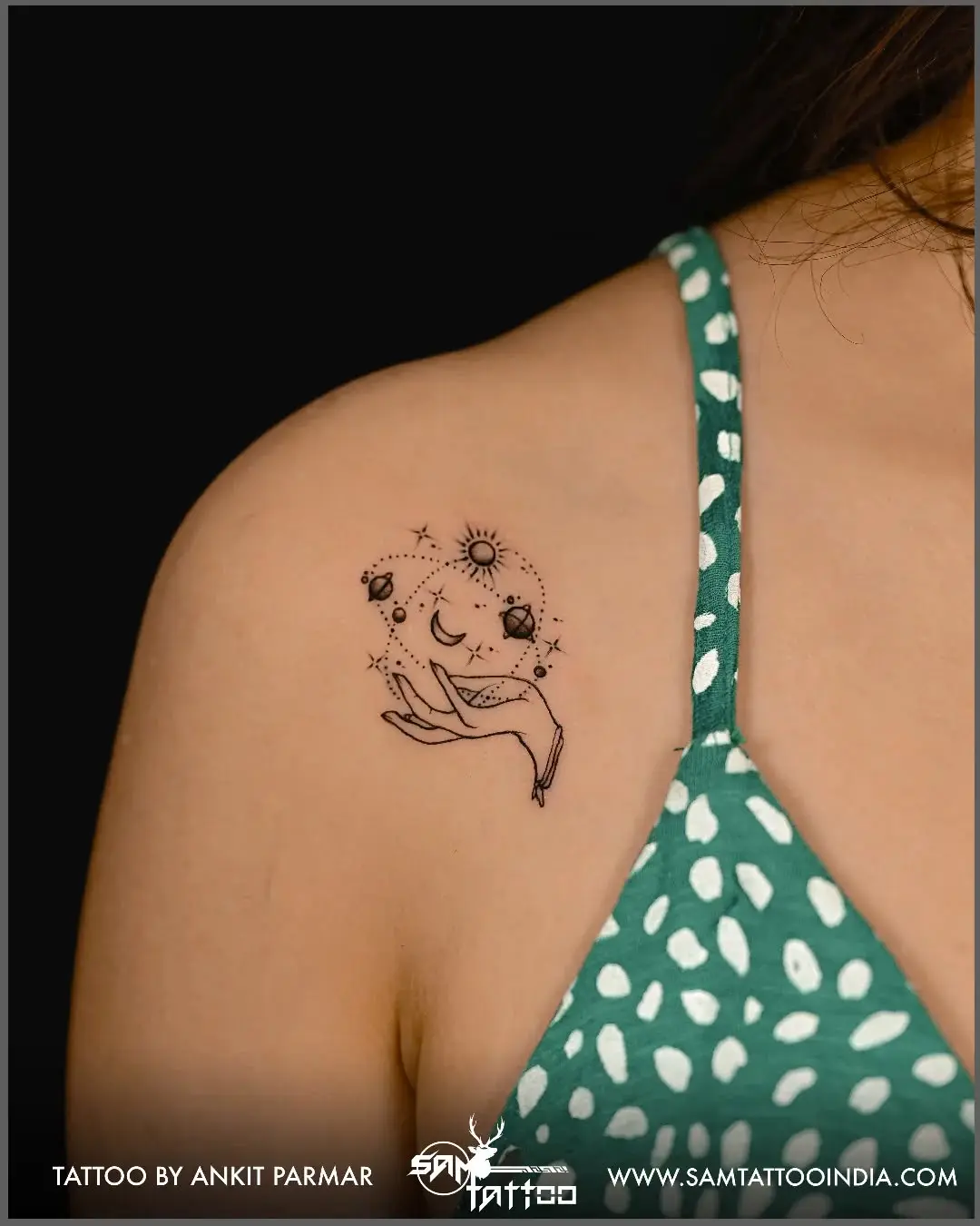 Whimsical Hand Holding Celestial Bodies Tattoo