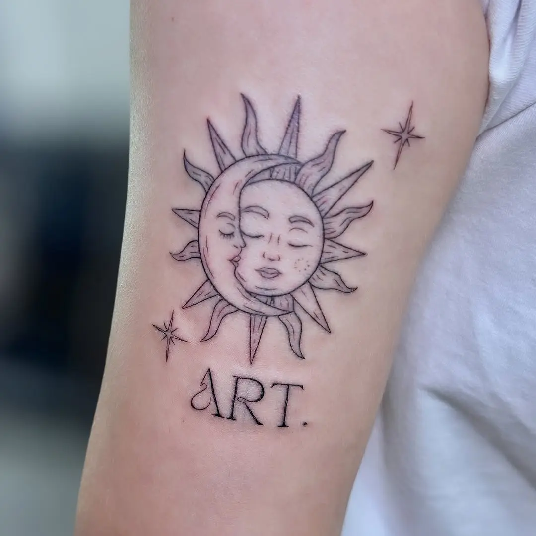 Intricate sun and moon tattoo with artistic flare