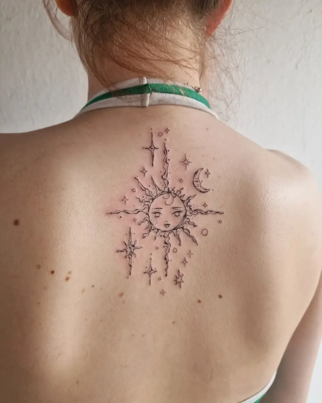 Celestial sun and moon tattoo design