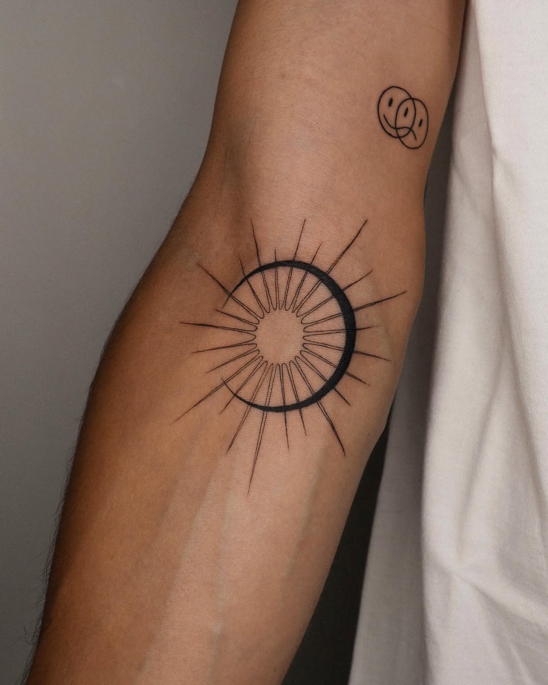 Minimalist sun and moon tattoo design idea