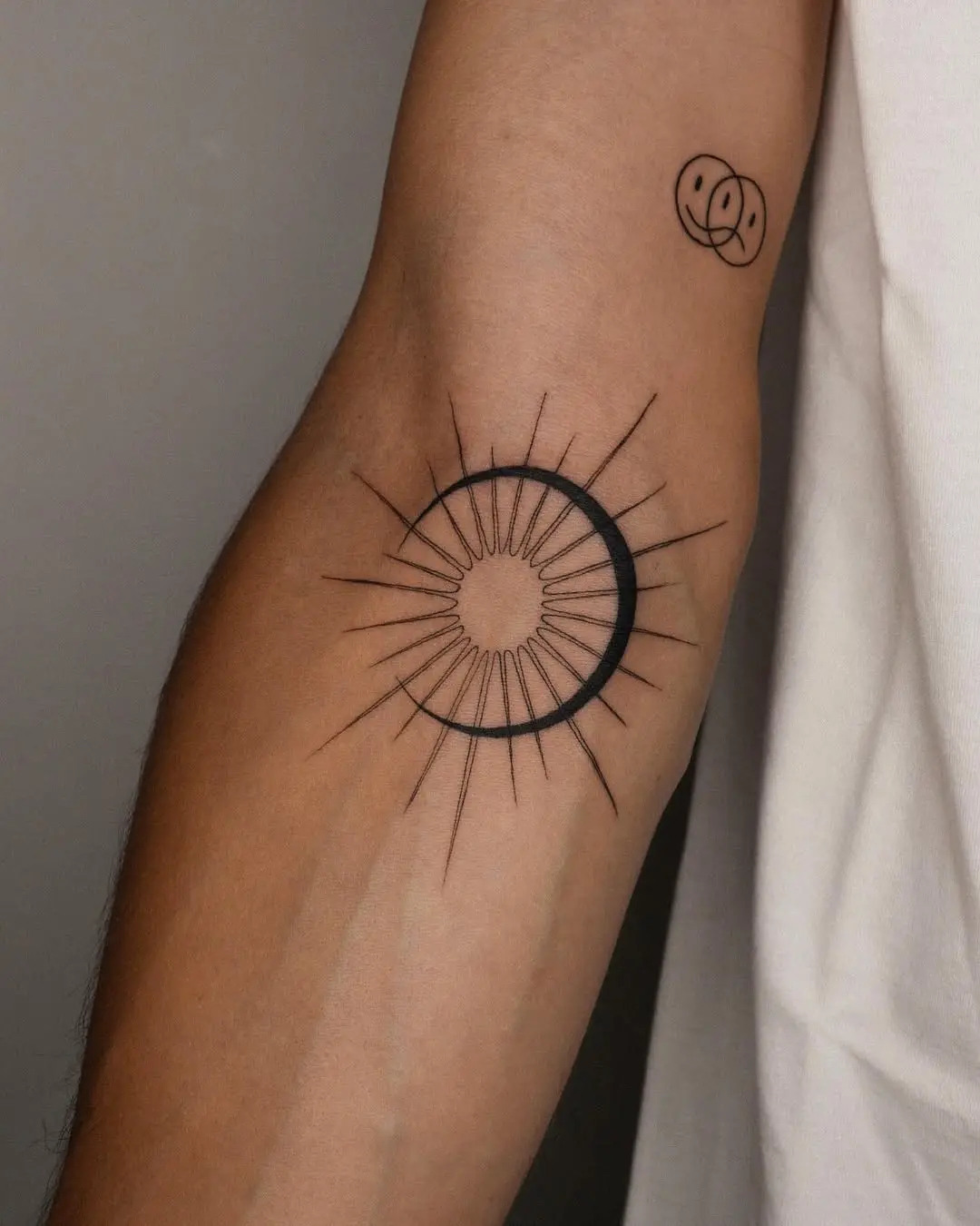 Minimalist sun and moon tattoo design idea