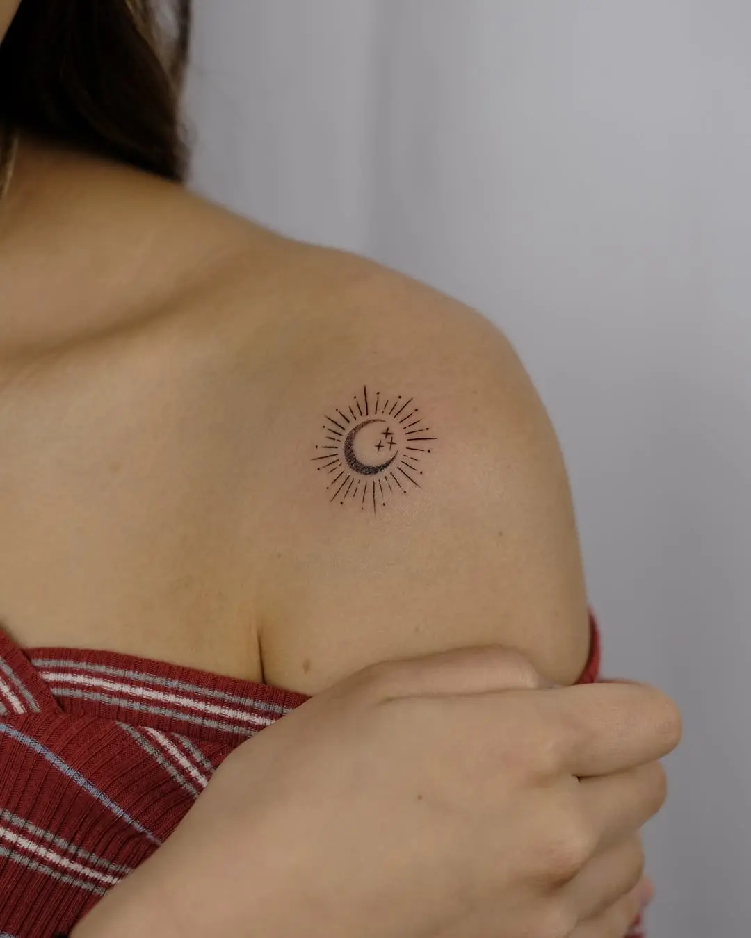Elegant sun and moon shoulder tattoo design