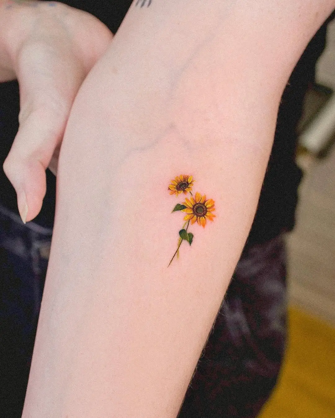 Vibrant sunflowers inked in delicate detail