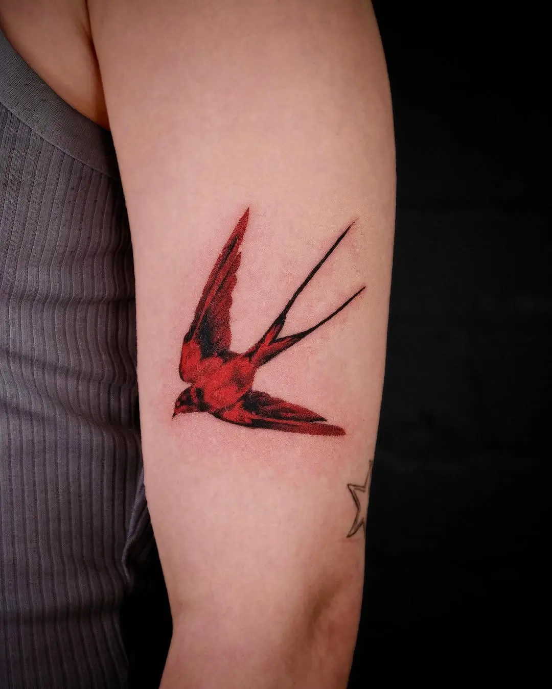 Elegant swallow tattoo symbolizing freedom and travel