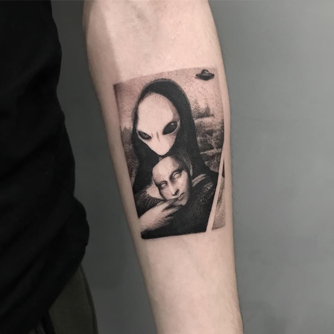 Alien meets classic art in tattoo form
