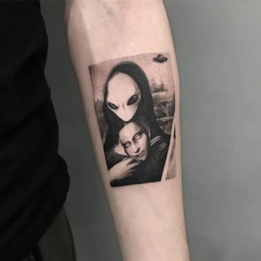 Alien meets classic art in tattoo form