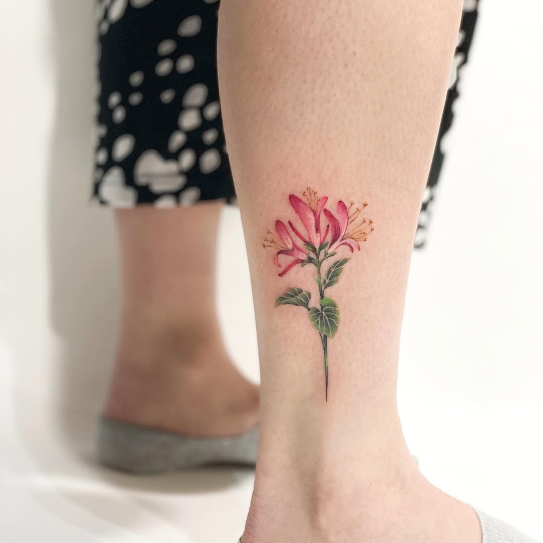 Delicate floral tattoo on the ankle