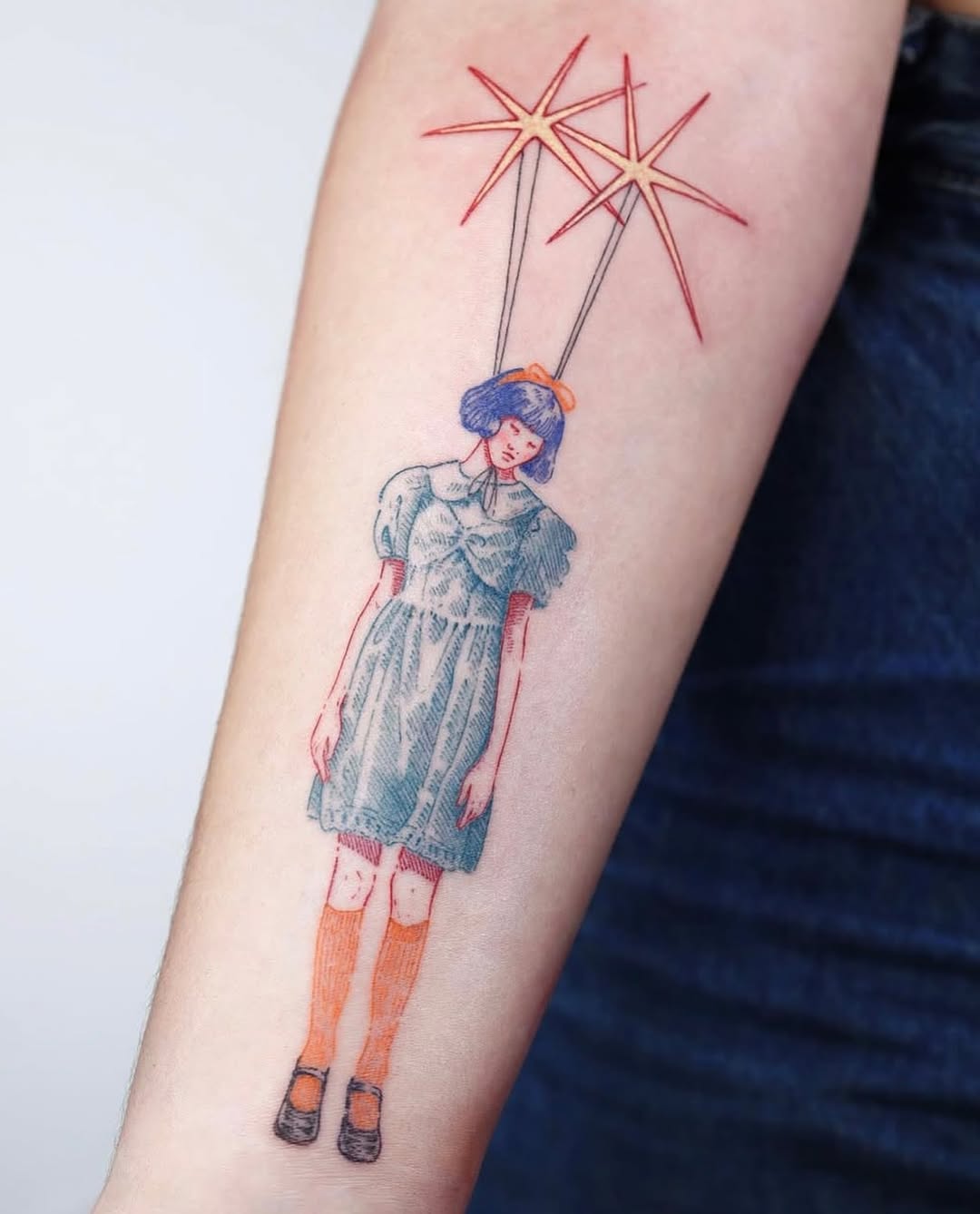 Unique artistic tattoo of a whimsical girl
