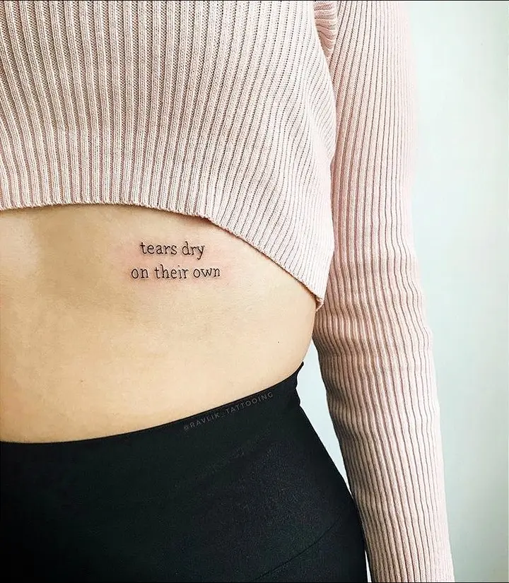Emotional quote tattoo expressing resilience