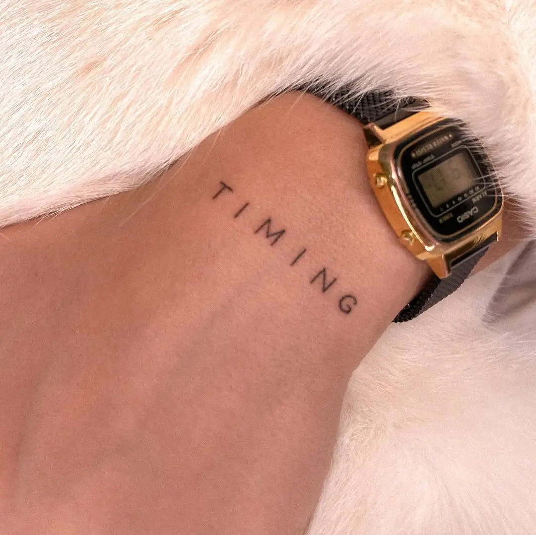 Minimalistic tattoo embodying the essence of timing