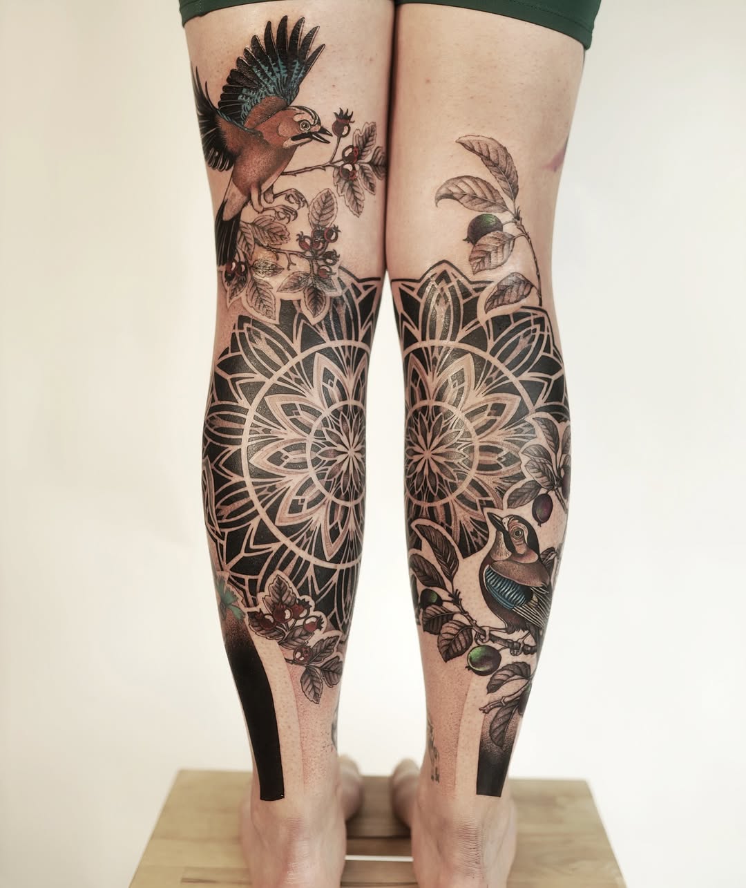 Stunning leg tattoos blend nature and geometry