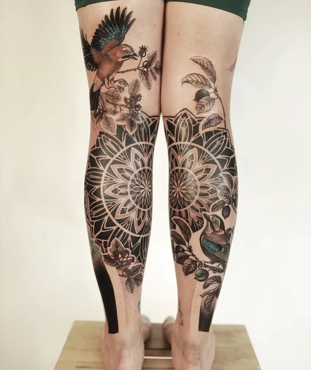 Stunning leg tattoos blend nature and geometry