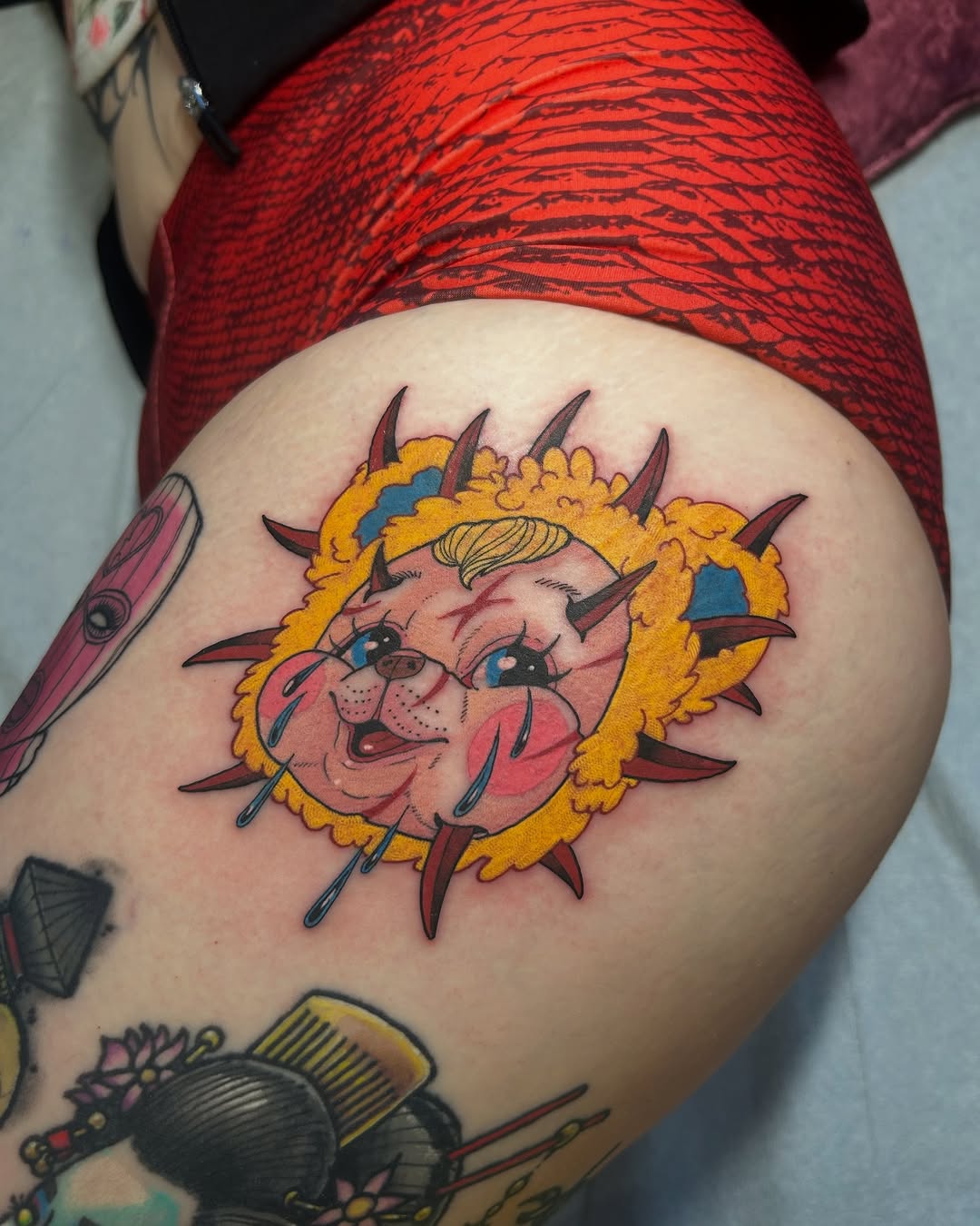 Cheerful cartoon dog thigh tattoo design