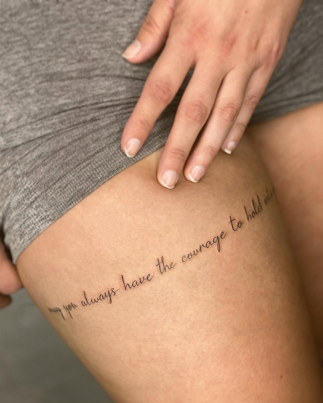 Elegant quote tattoo for courage and strength