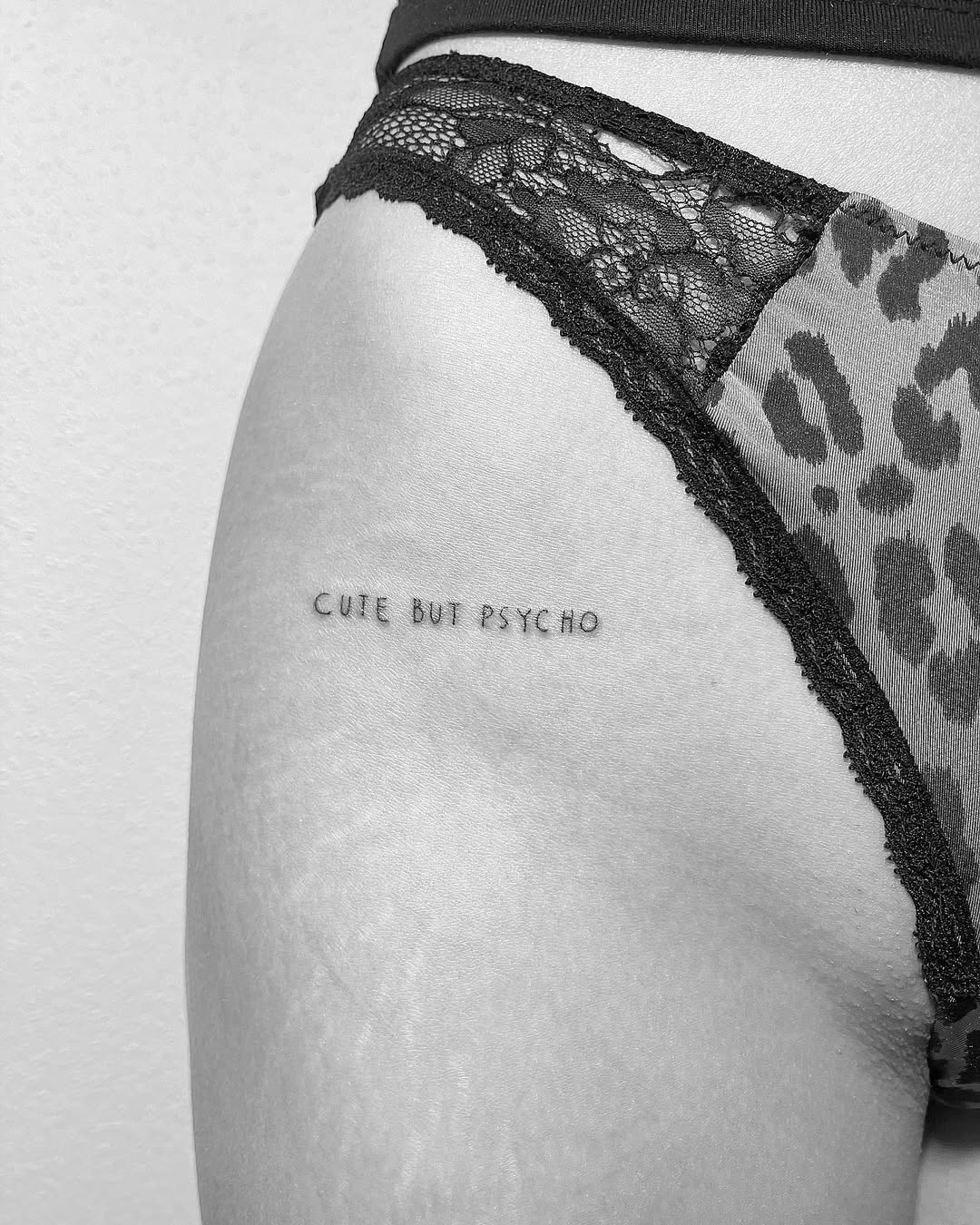 Playful thigh tattoo for bold statements