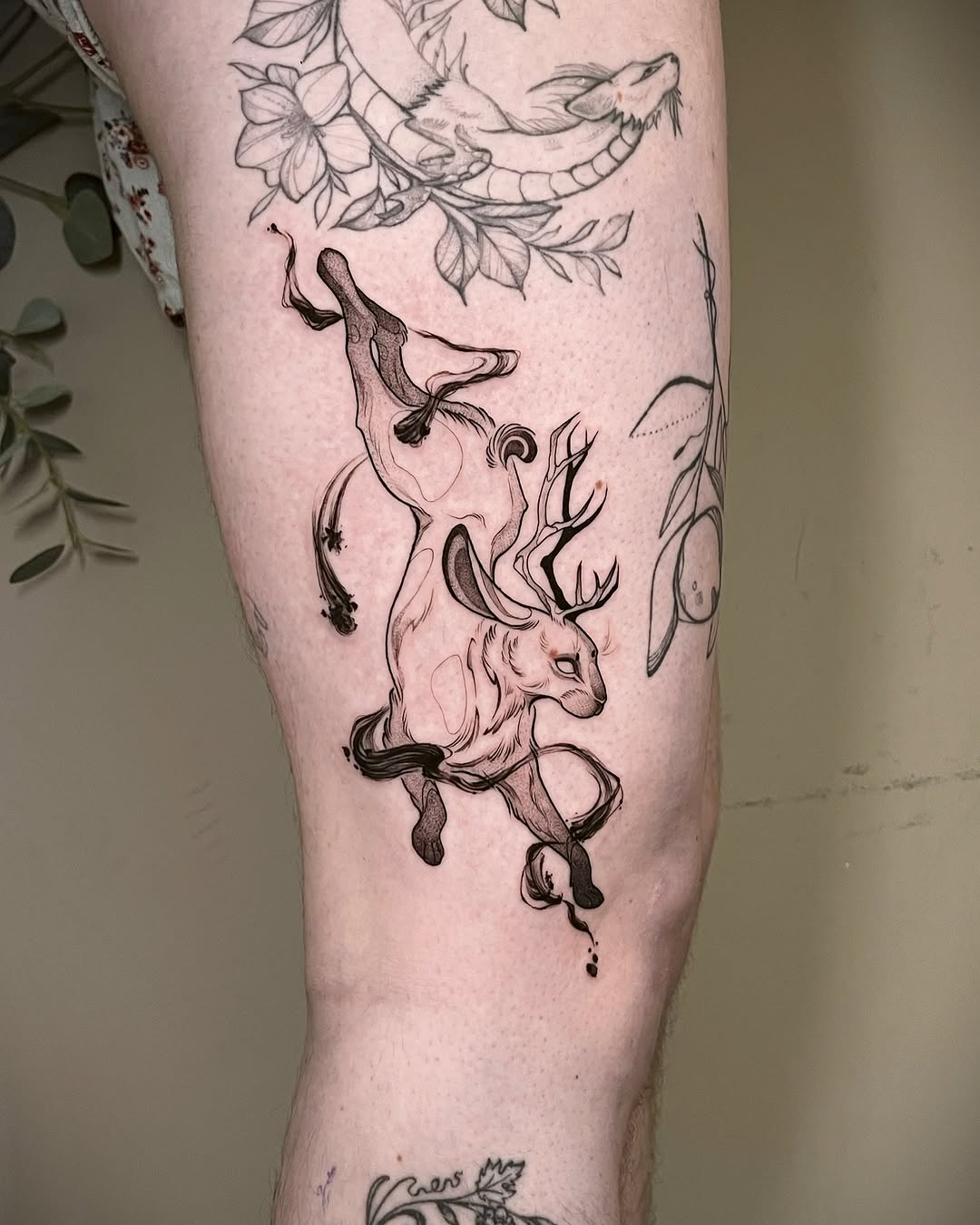 Majestic deer tattoo in fluid motion