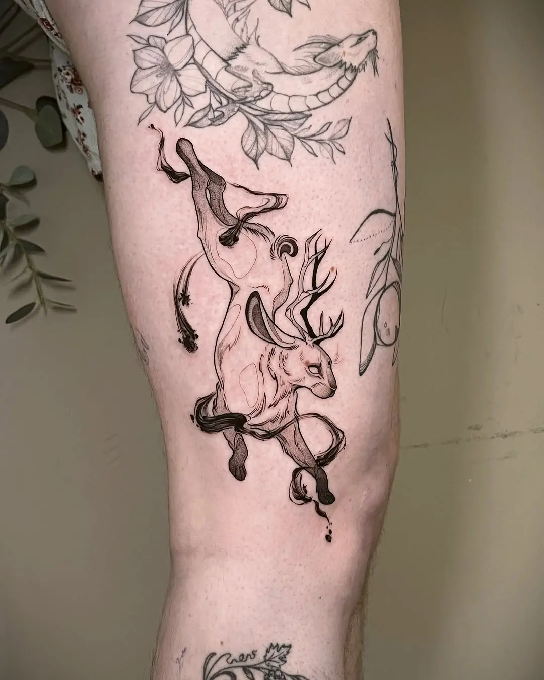 Majestic deer tattoo in fluid motion