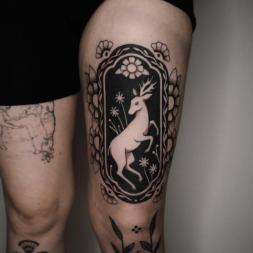 Stunning deer tattoo in floral frame