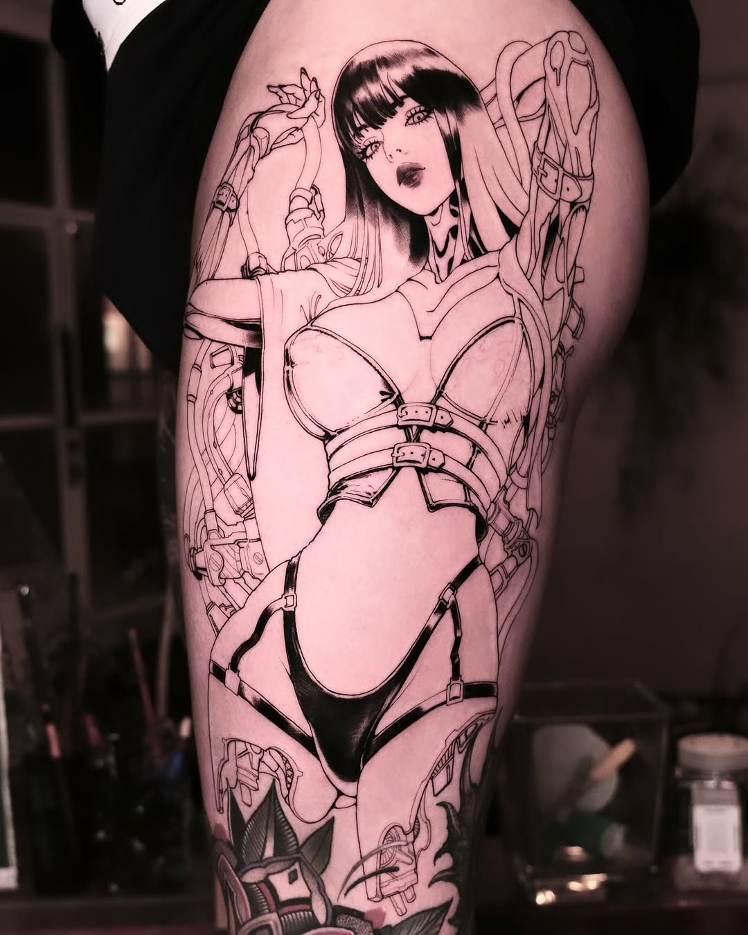 Futuristic thigh tattoo showcasing a bold design