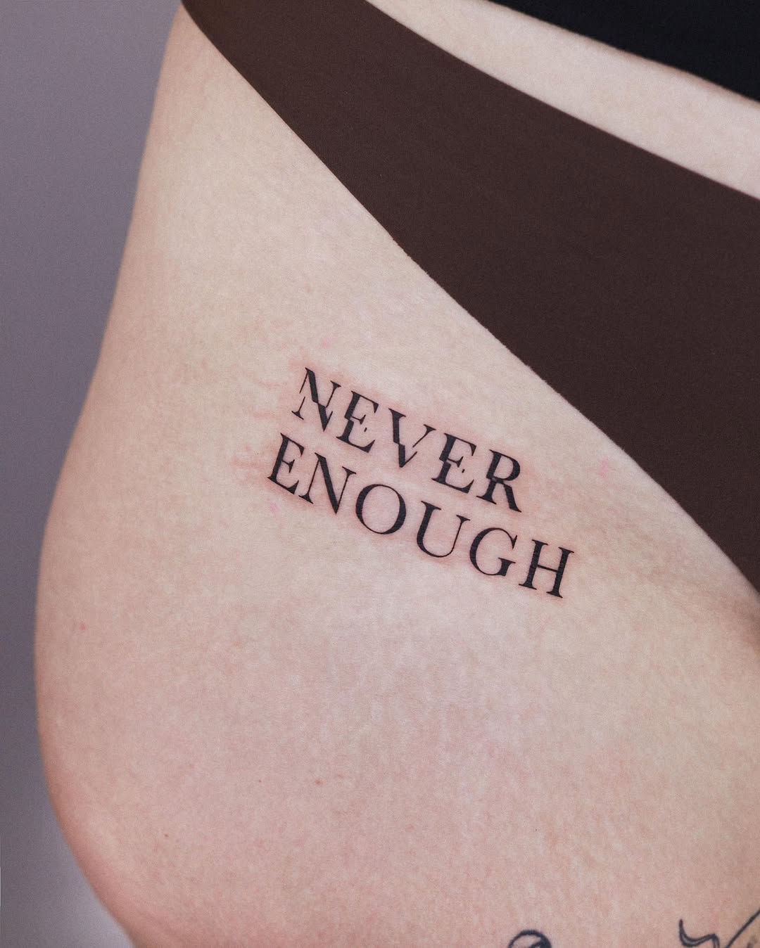 Minimalist Tattoo with Profound Text Meaning