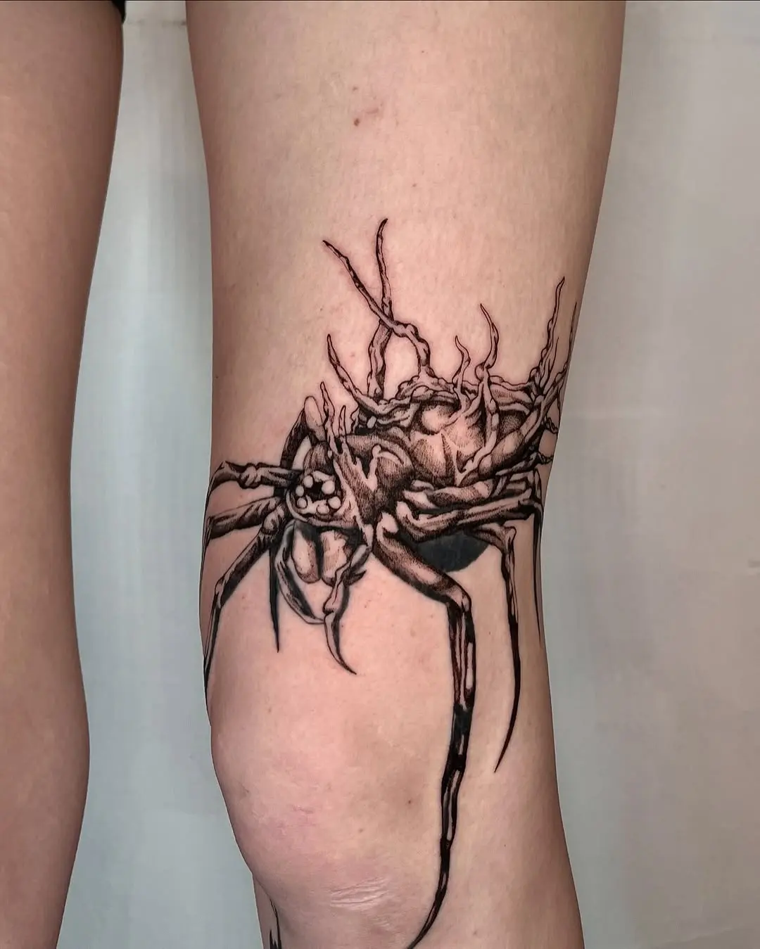 Stunning spider tattoo on thigh with intricate details
