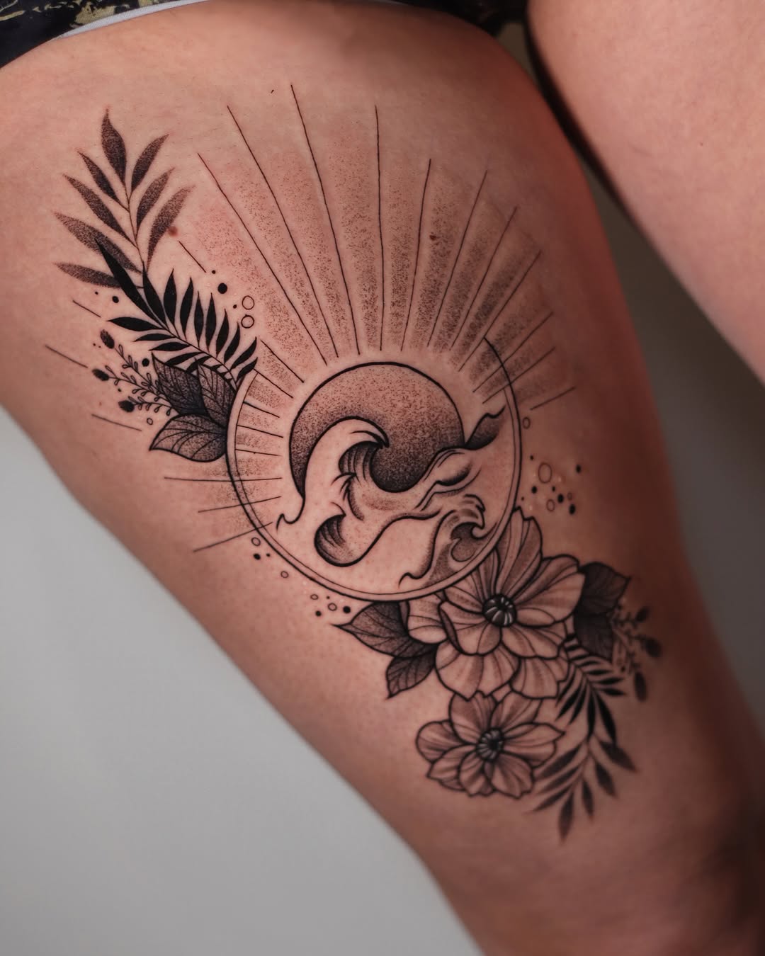Stunning tattoo combining nature and wave elements