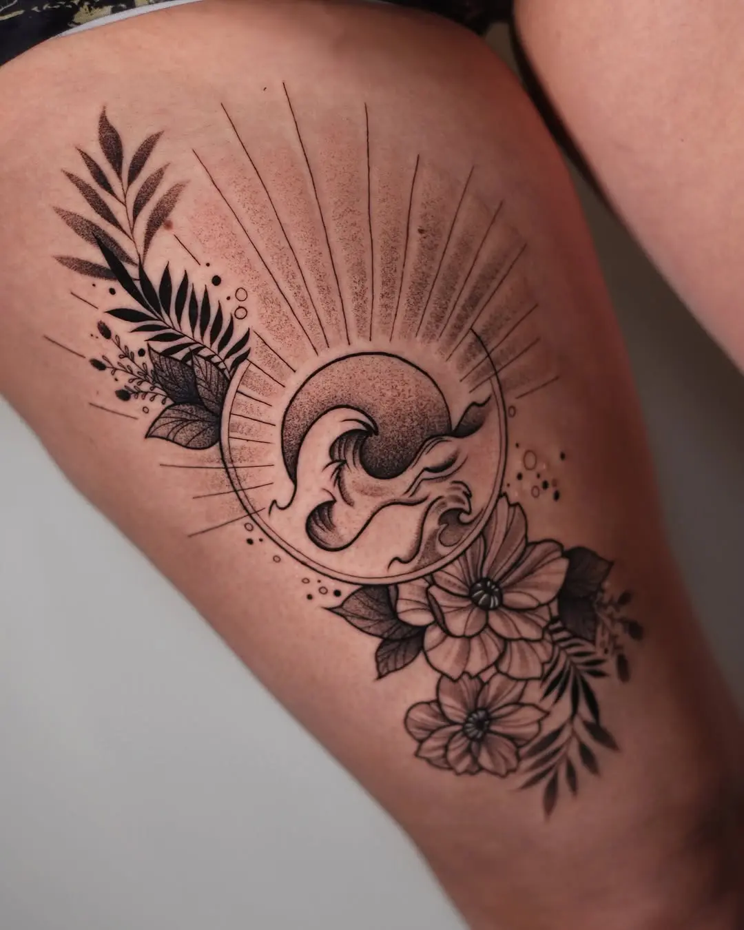 Stunning tattoo combining nature and wave elements