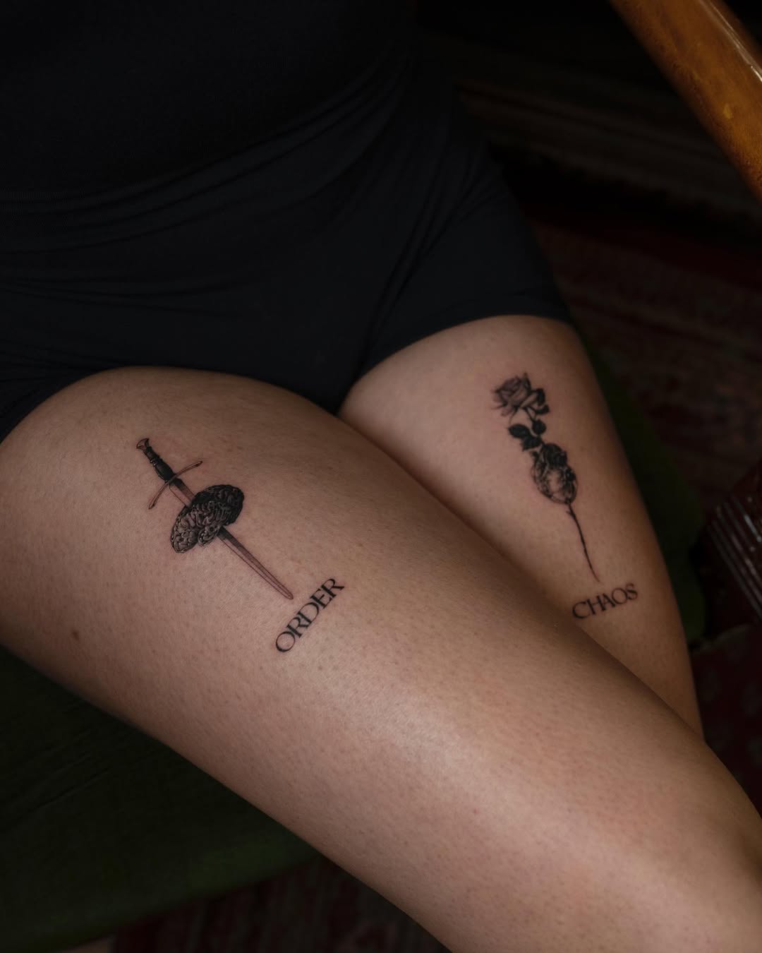 Dramatic thigh tattoos embody order and chaos