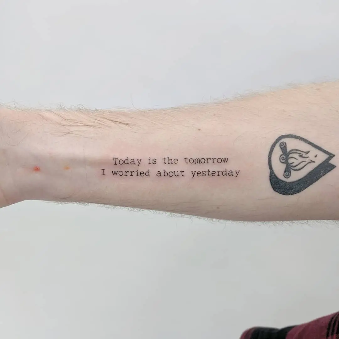 Inspirational quote tattoo on forearm