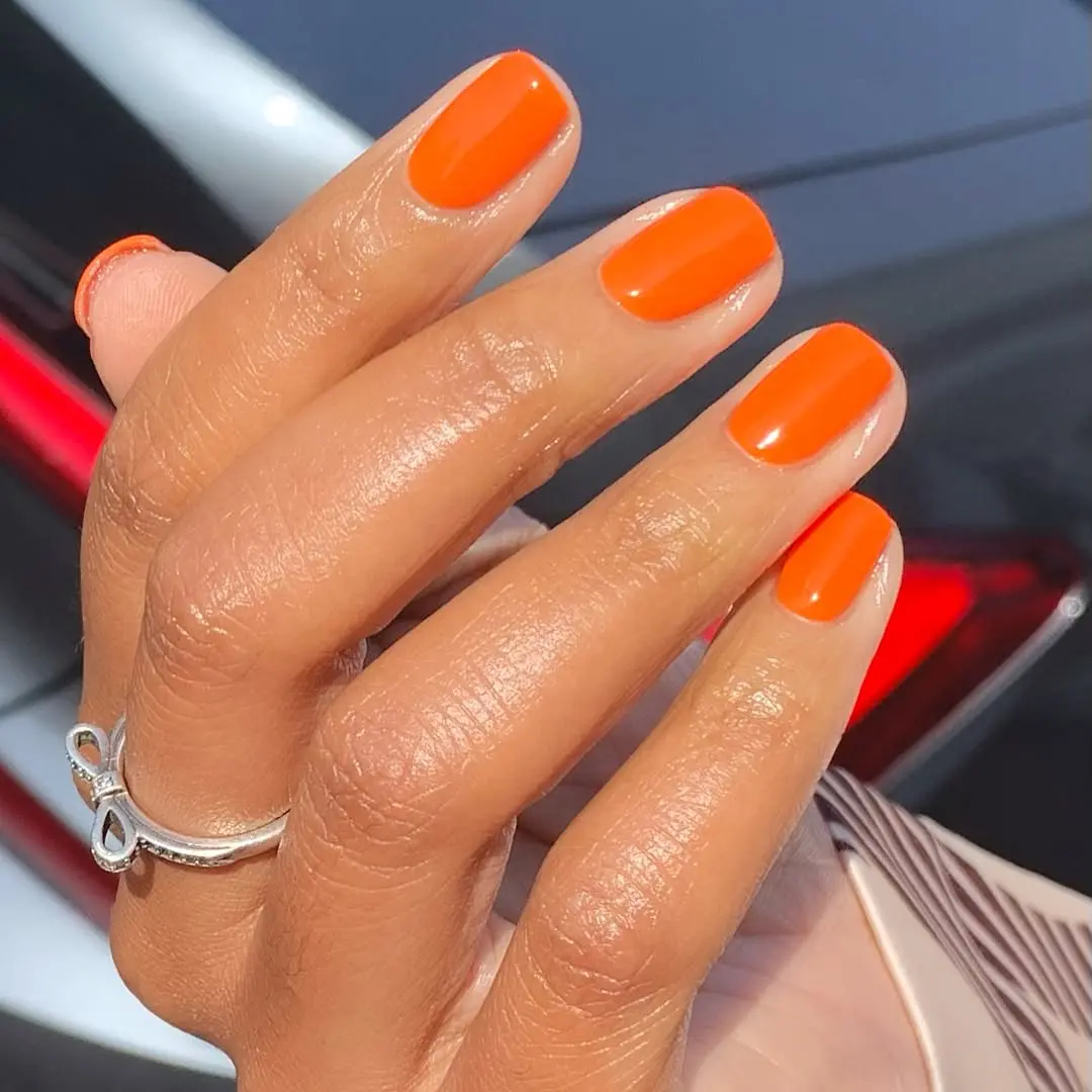 Vibrant orange nails for summer vibes