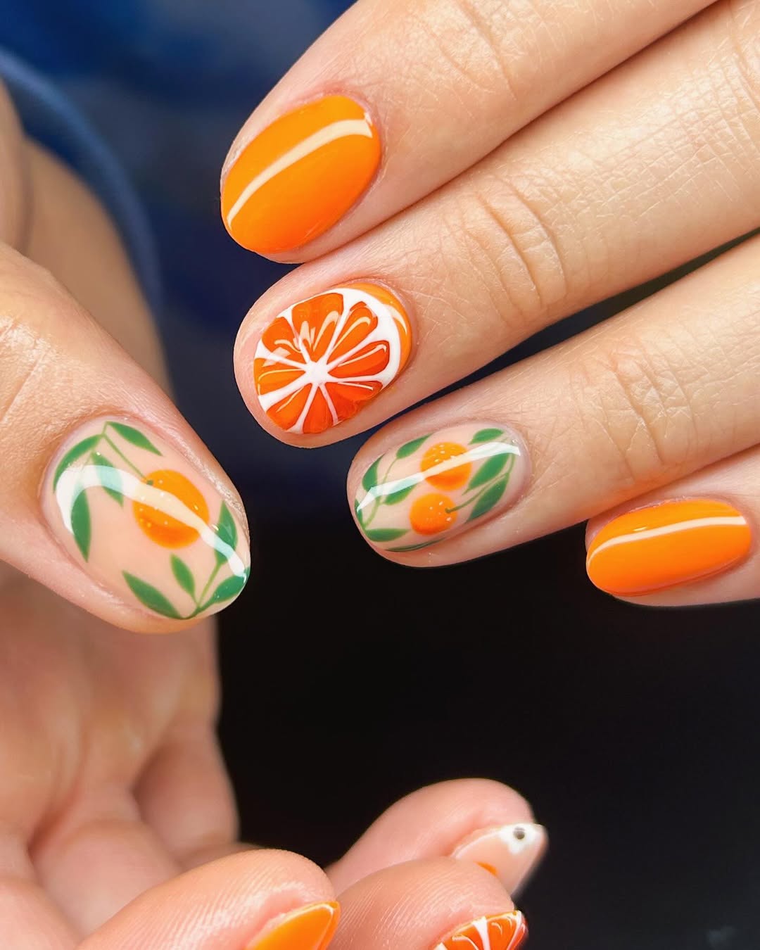 Charming orange nails with citrus accents