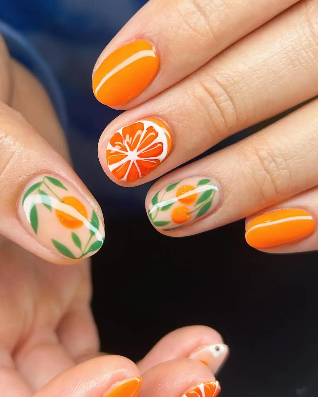 Charming orange nails with citrus accents