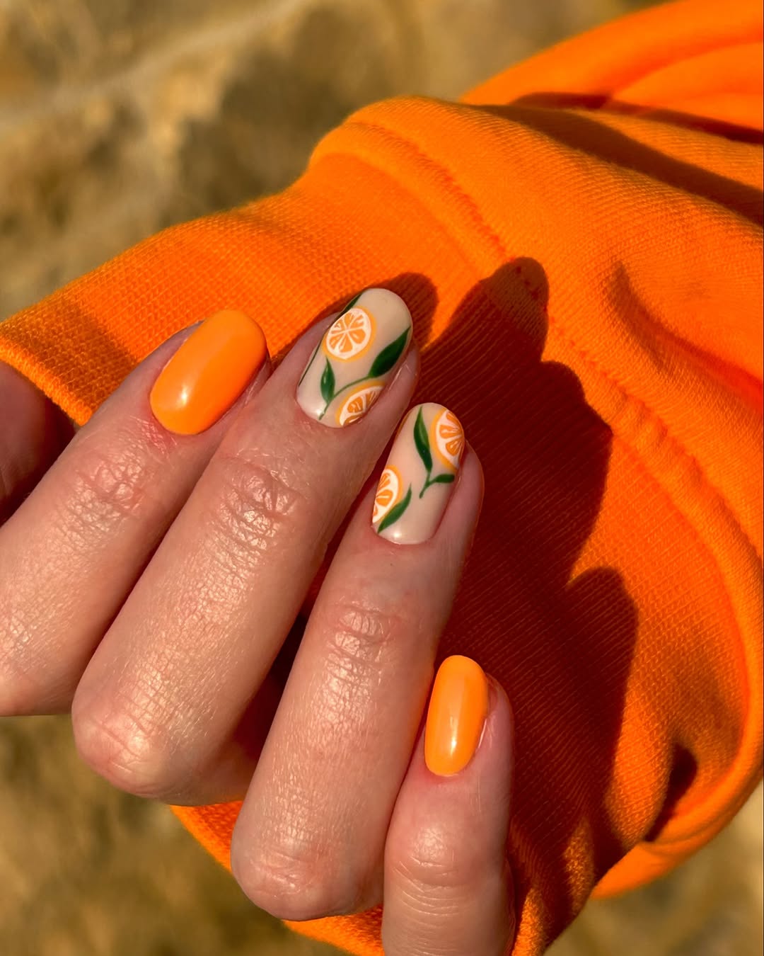 Vibrant Orange Citrus-Inspired Nail Art