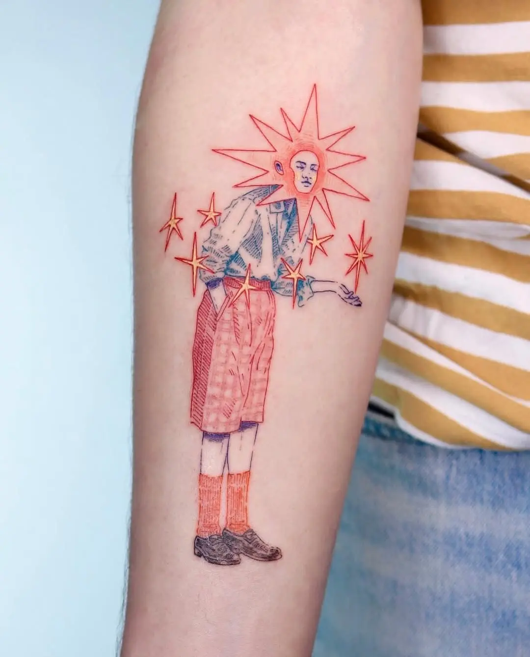 Whimsical character tattoo with vibrant star details