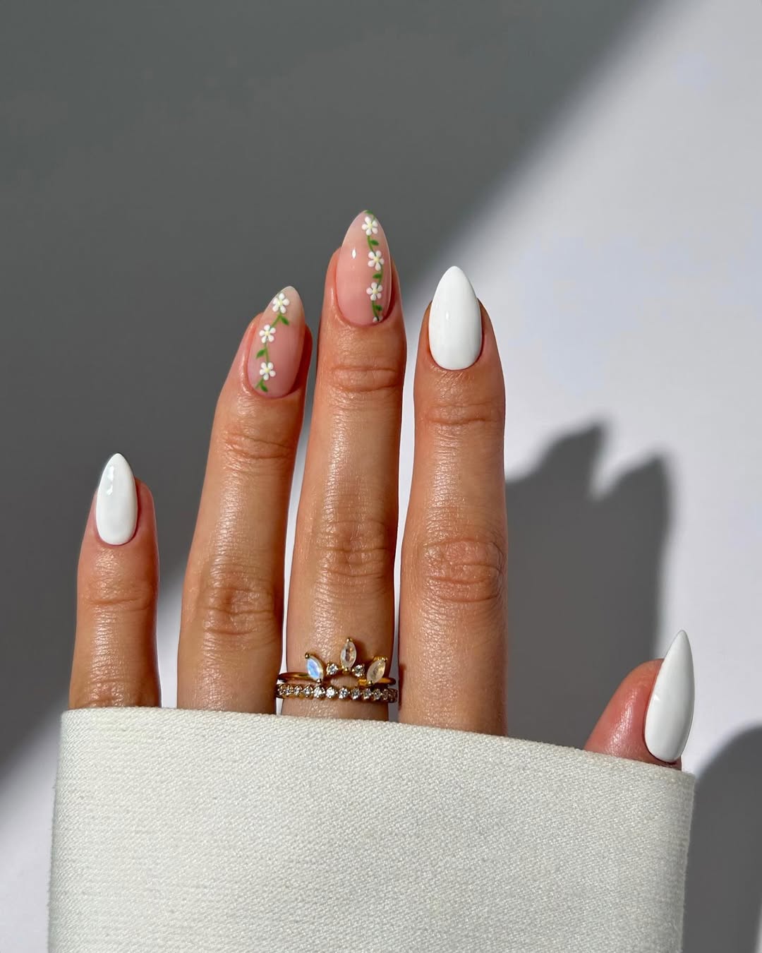Chic white nails adorned with floral accents