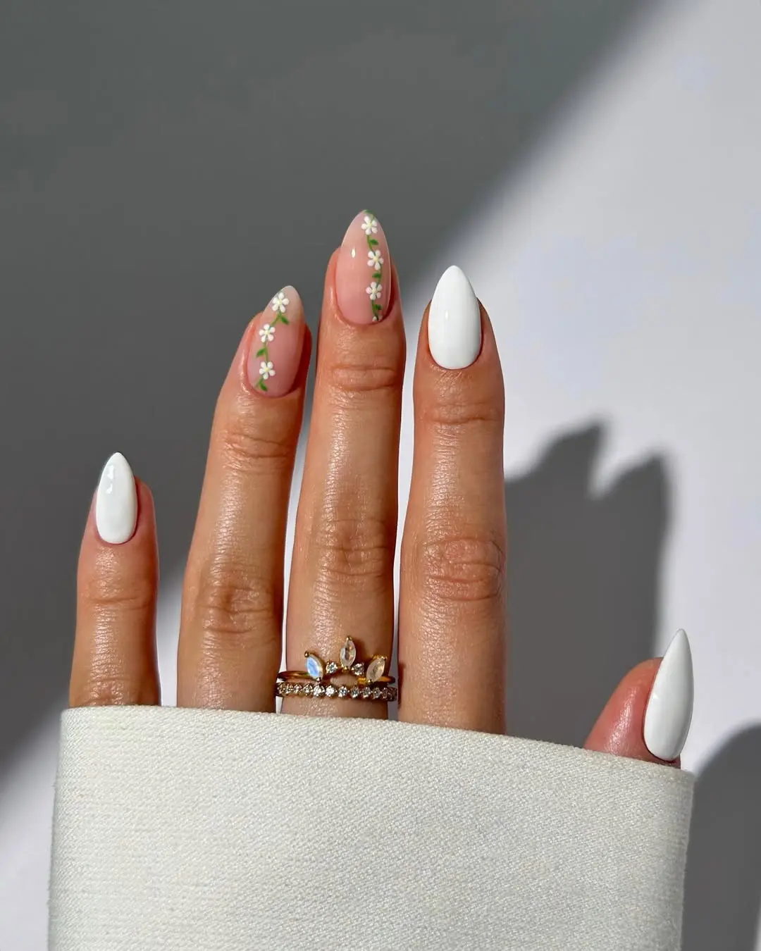 Chic white nails adorned with floral accents