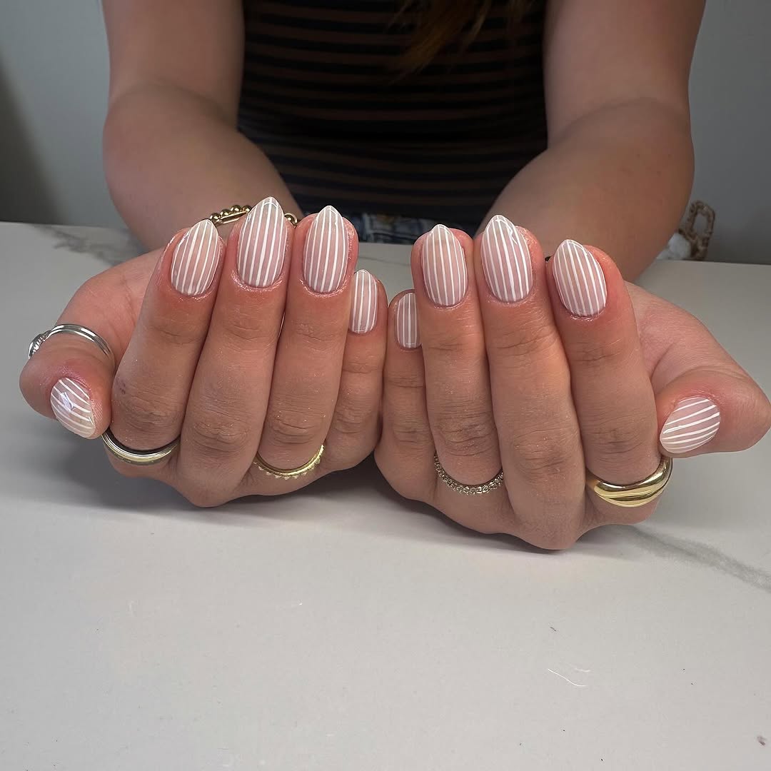 Chic white nails with elegant stripes