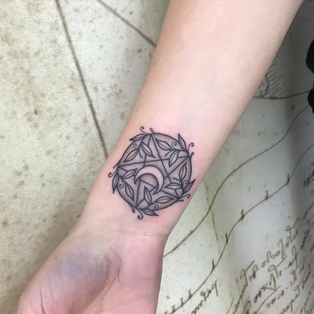 Intricate witchy tattoo with lunar symbolism