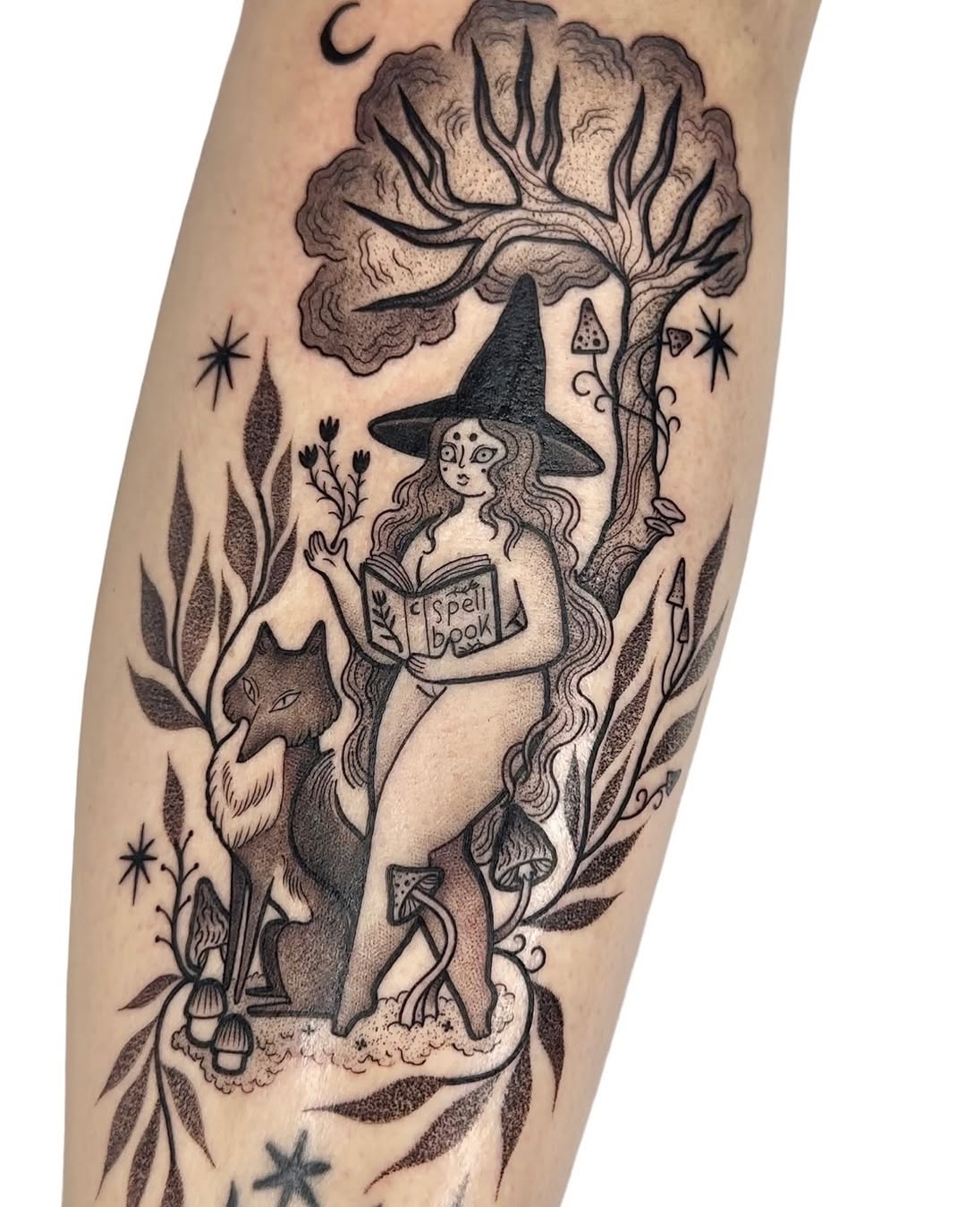 Enchanting witch tattoo with spell book details