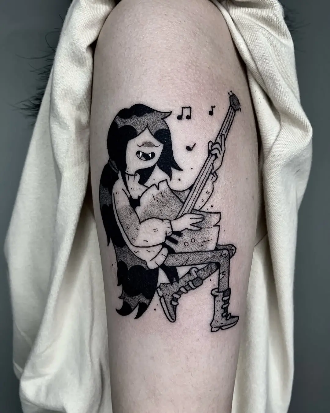 Charming witchy music tattoo for creative souls