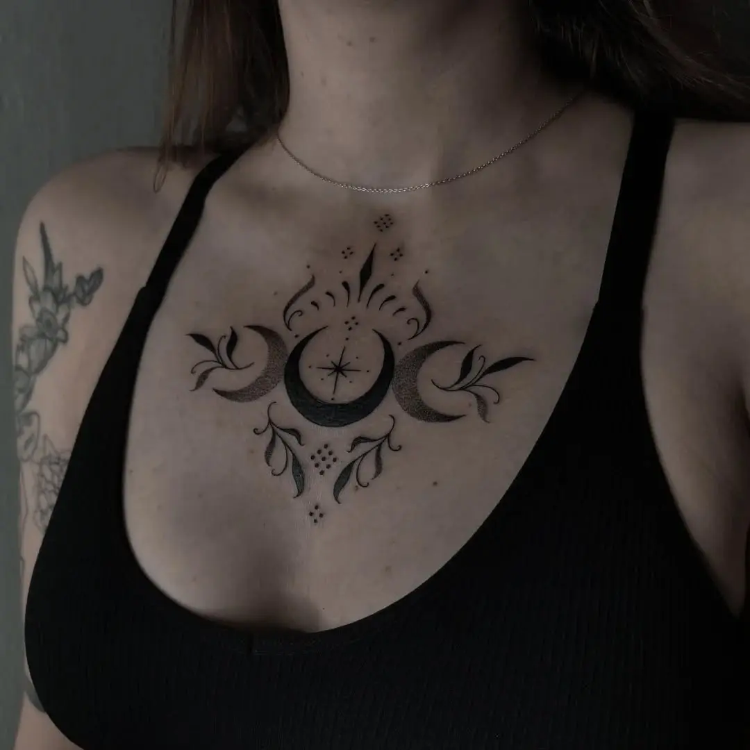 Mystical moon and floral tattoo design