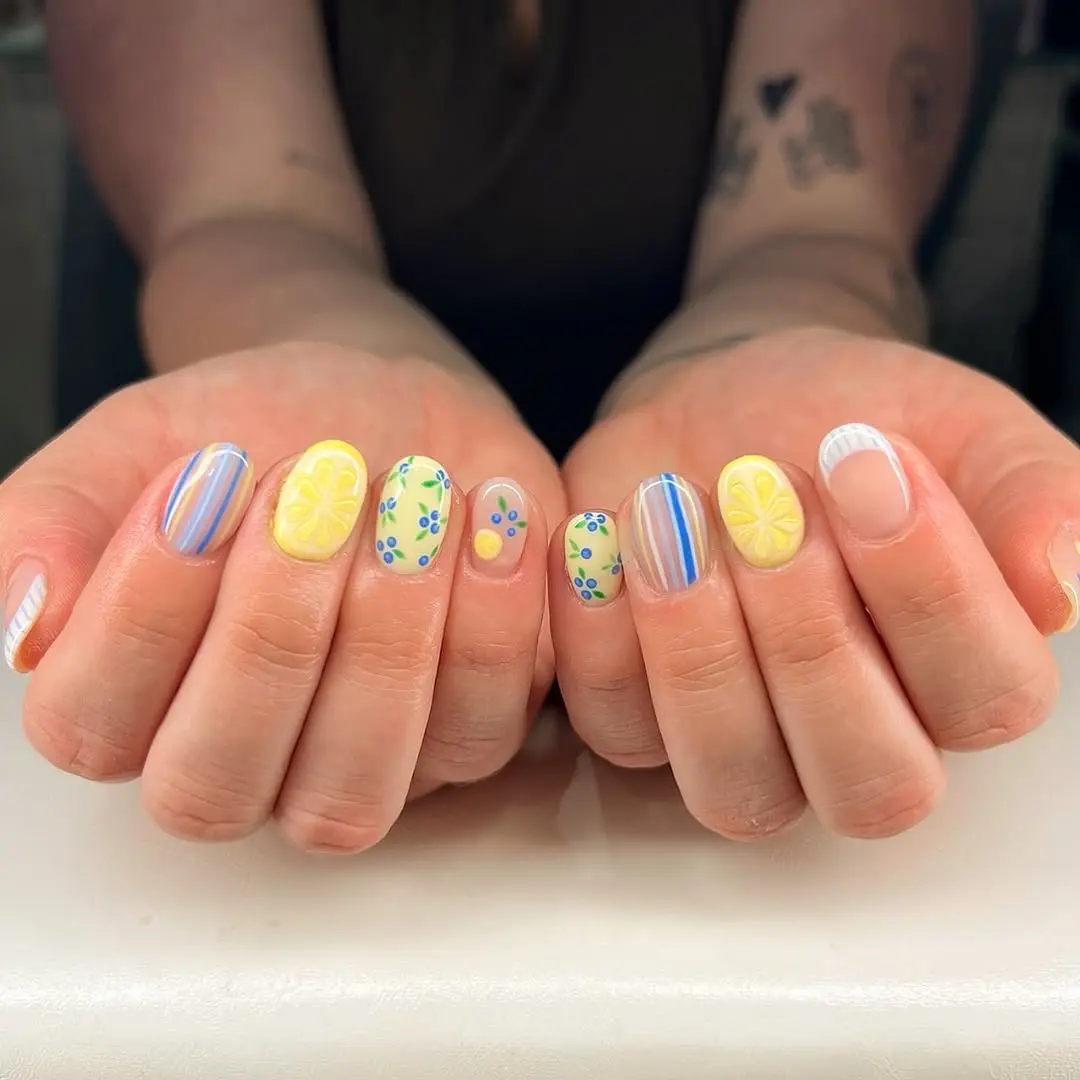 Vibrant yellow nails with playful designs