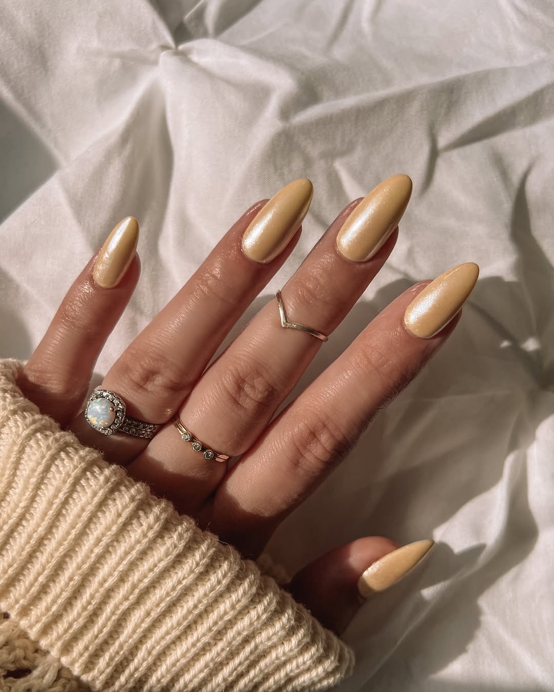 Chic yellow nails with elegant rings showcased