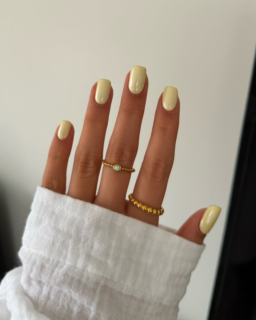 Chic yellow nails with golden accents