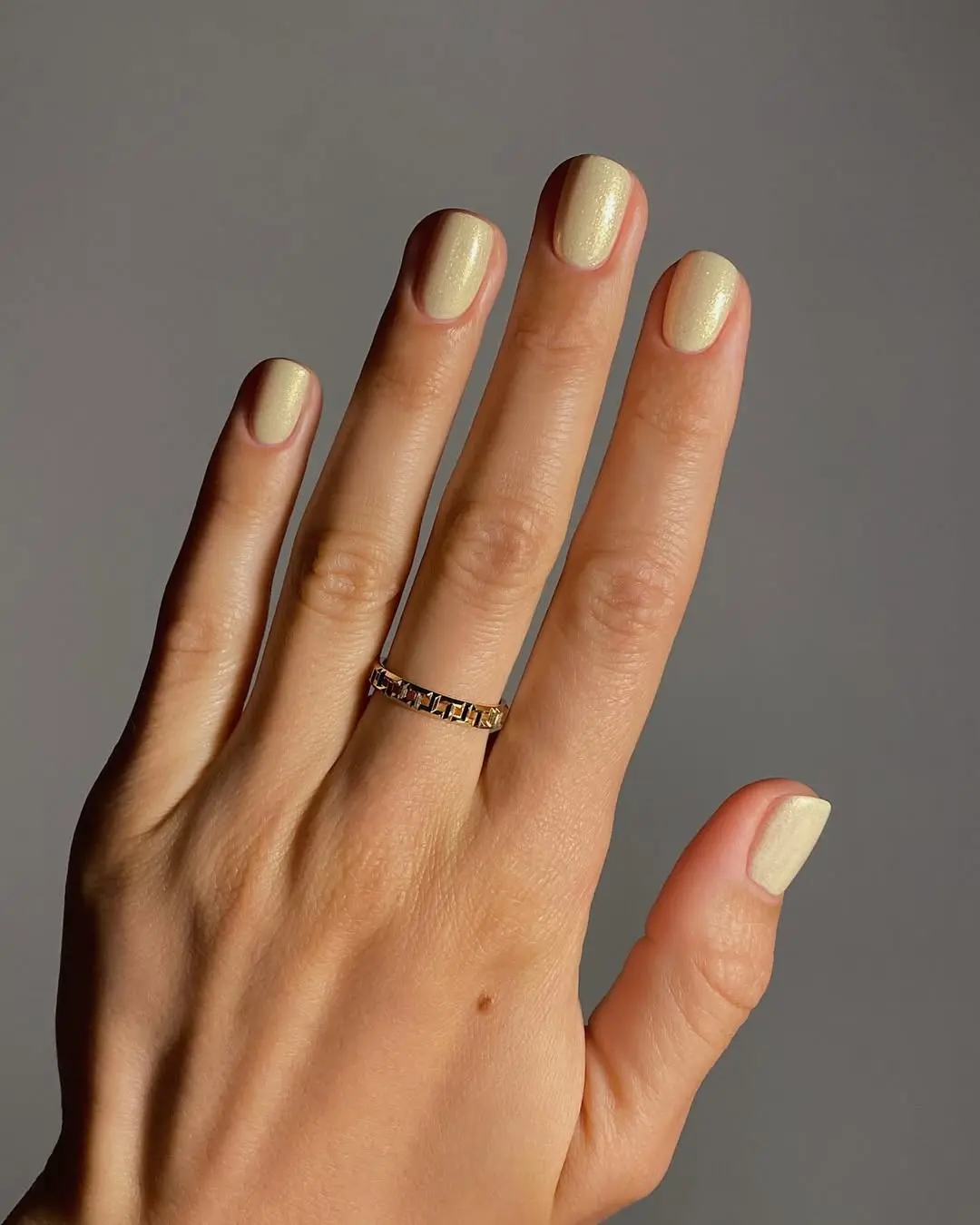 Glistening yellow nails shine elegantly