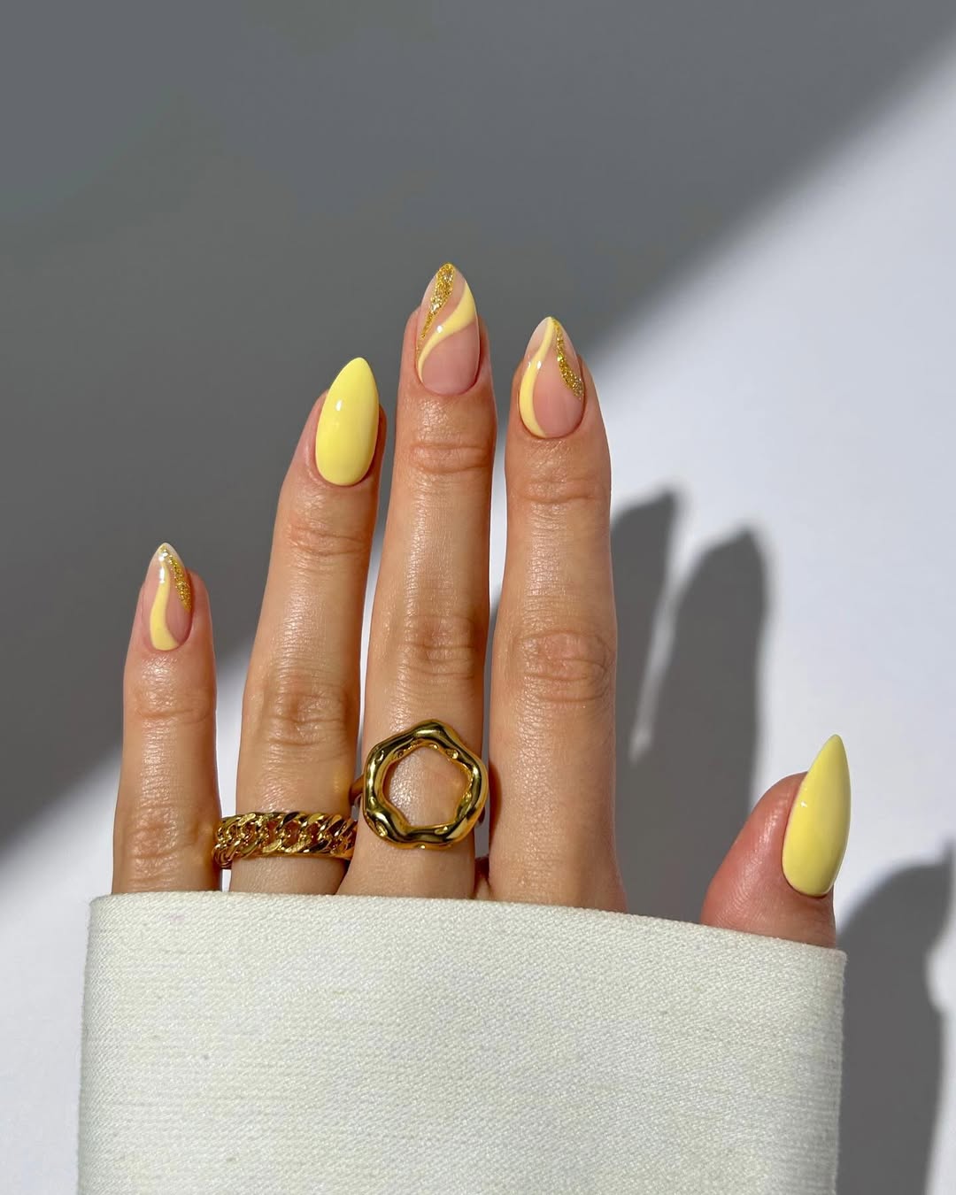 Chic yellow nails with trendy accents