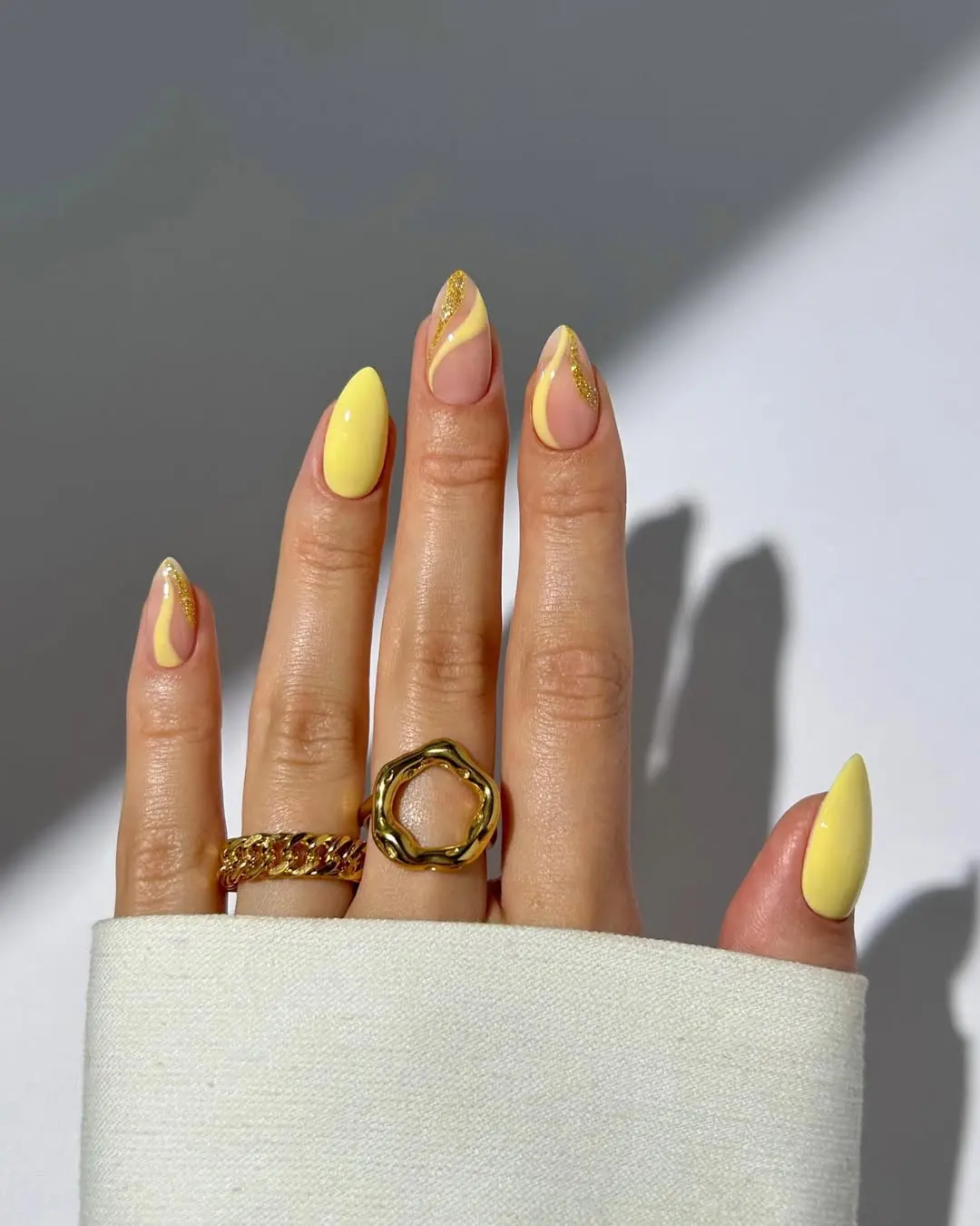 Chic yellow nails with trendy accents